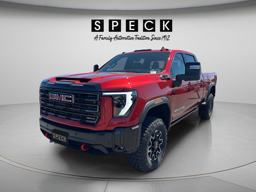 2026 GMC Sierra 2500 HD AT4X in Volcanic Red Tintcoat — front three-quarter view