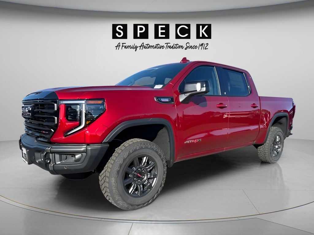 2026 GMC Sierra 1500 AT4X in Volcanic Red Tintcoat — front three-quarter view