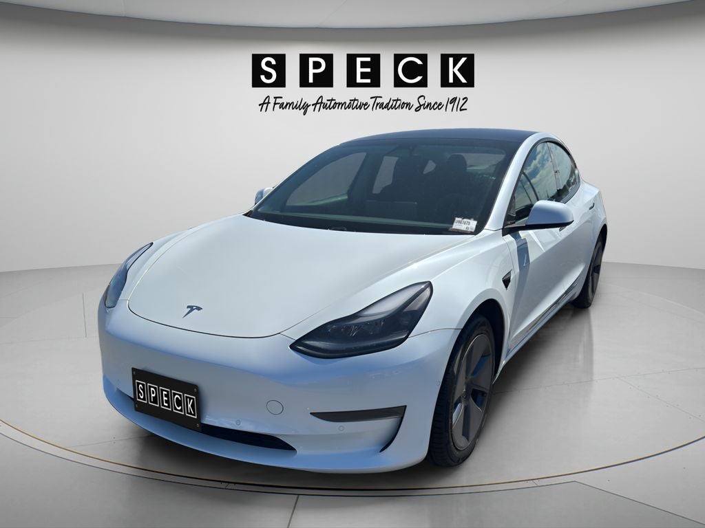 2021 Tesla Model 3 Standard Range Plus in White — front three-quarter view