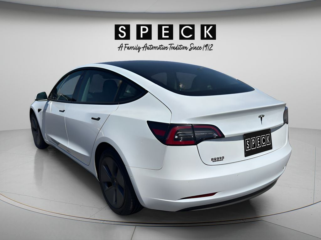 2021 Tesla Model 3 — rear three-quarter view