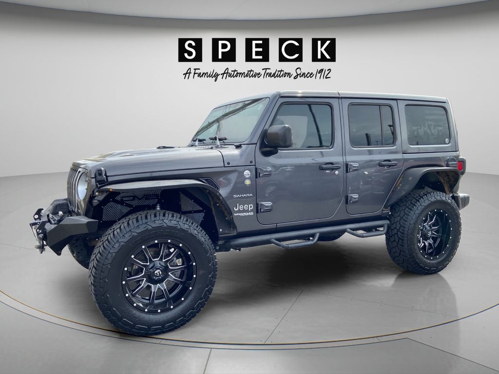 2022 Jeep Wrangler Unlimited Sahara in Granite Crystal Metallic Clearcoat — front three-quarter view