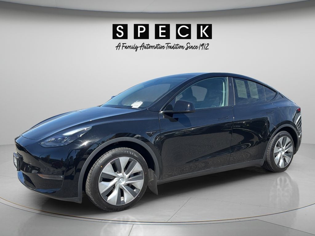 2024 Tesla Model Y Long Range in Solid Black — front three-quarter view